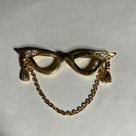 Avon golden eyeglass holder brooch with gold tassel. - Picture 1 of 4